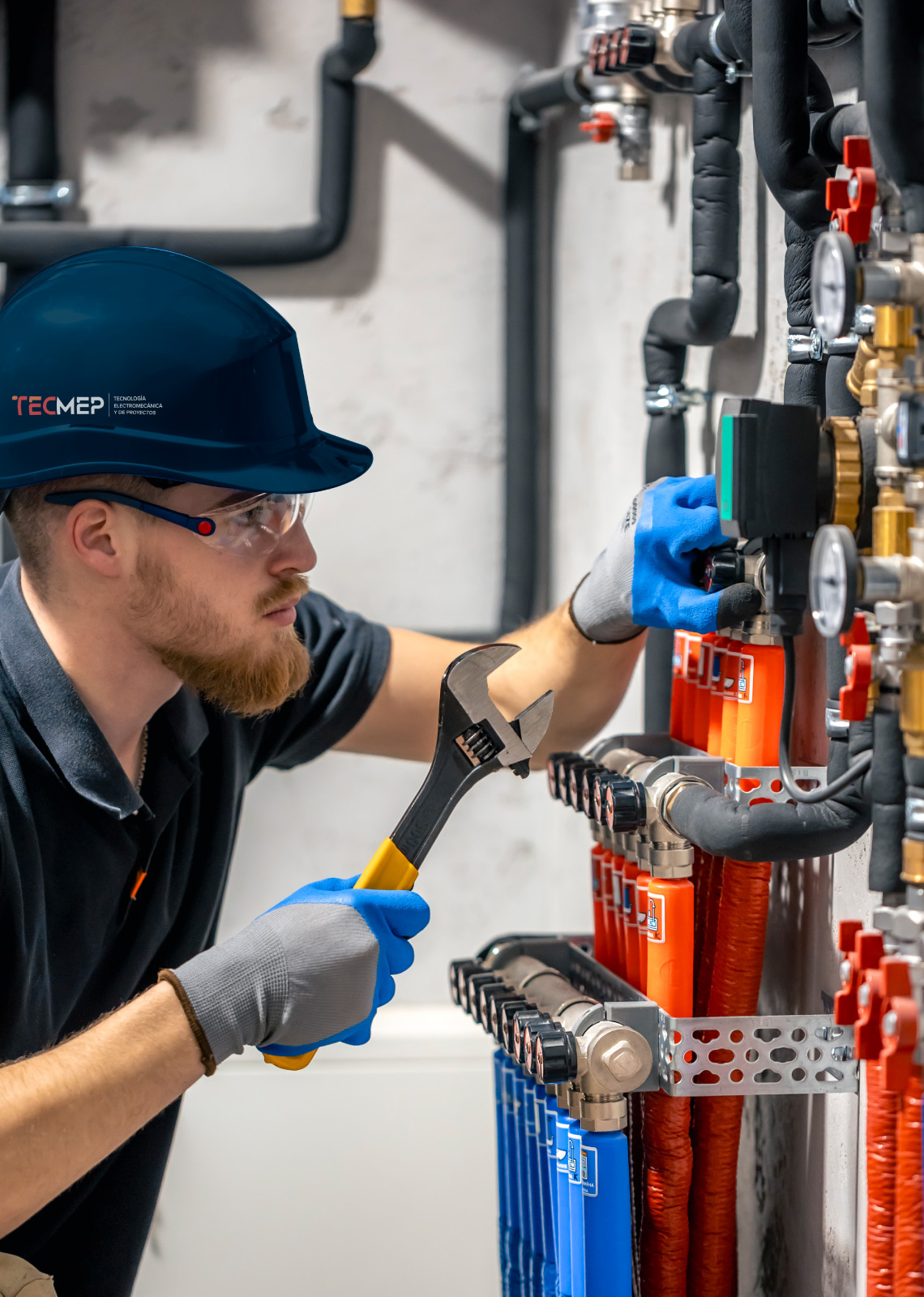 tecmep technician checking heating system boiler room